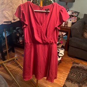 Ann Taylor size 0, wrap skirt type dress. Flutter sleeve. Berry colored, lined